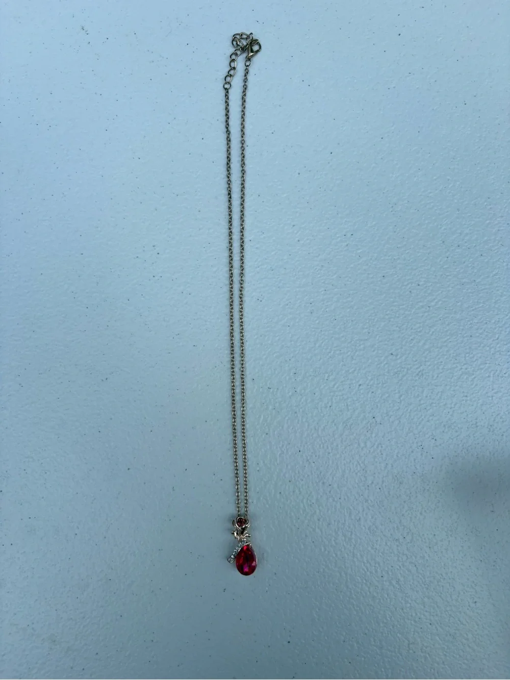 Delicate gold Necklace with Red Teardrop Pendant
